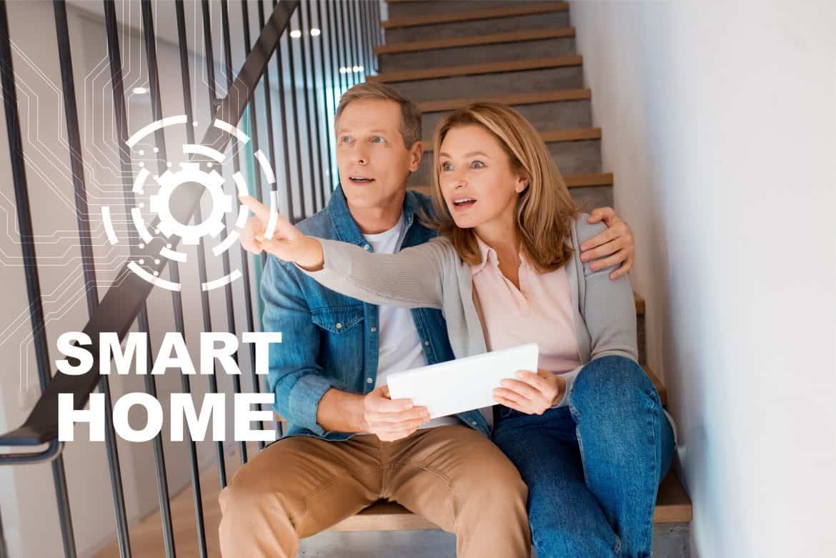 Couple On Stairs In A Smart Home