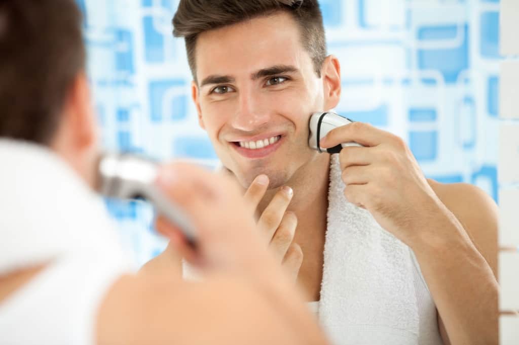 Closeup Of A Shaving Man