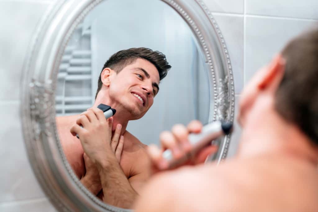 Man Shaving With Electric Razor
