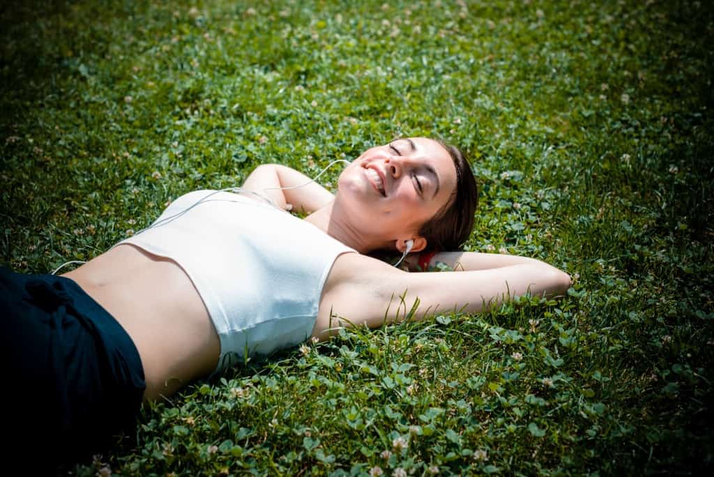 Woman Lying On Lawn
