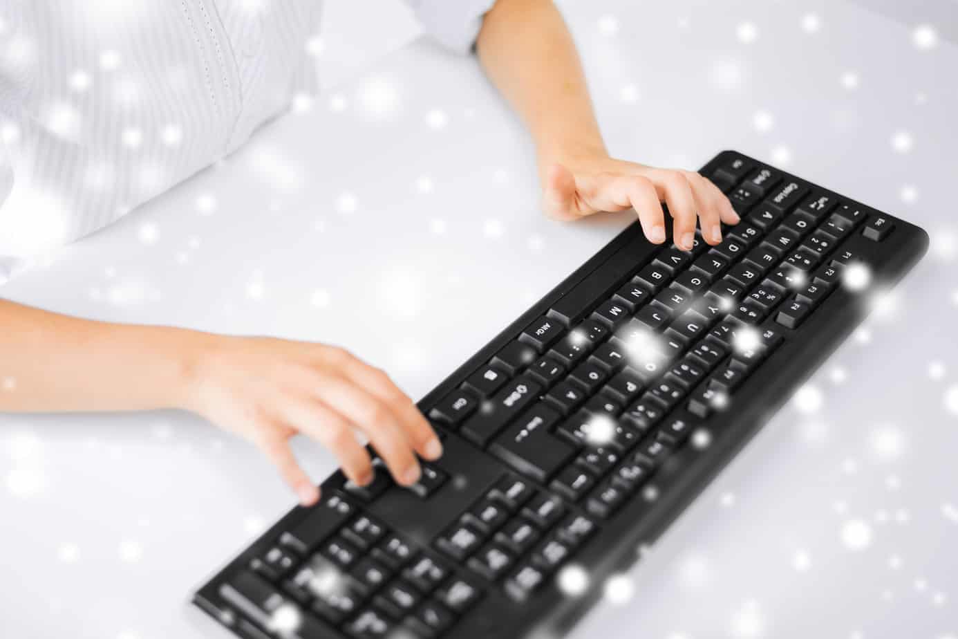 student girls hands typing on keyboard