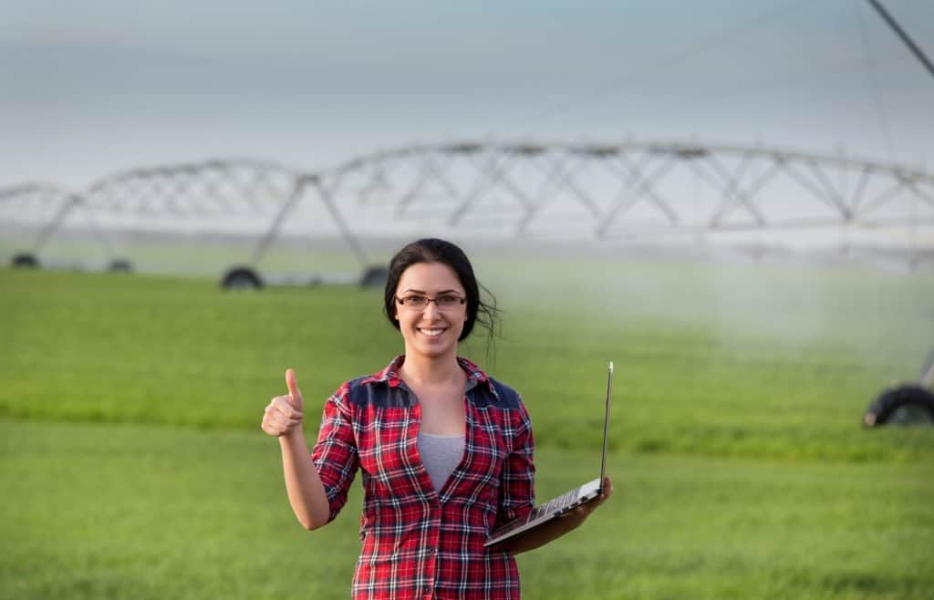 woman farmer with smart sprinklers