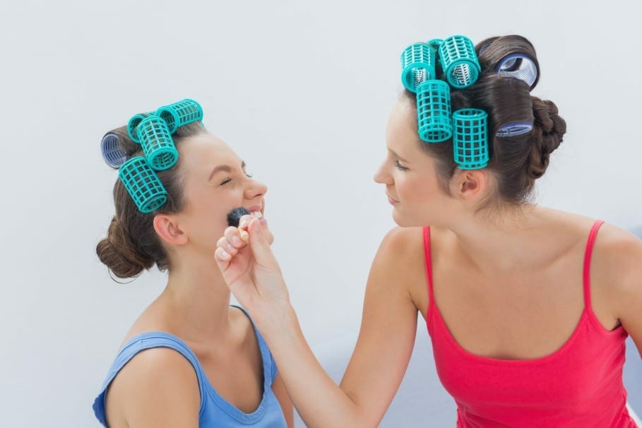 woman goofing with hair roller